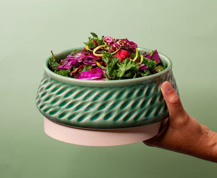 Aqua Horizon Bowl held in one hand